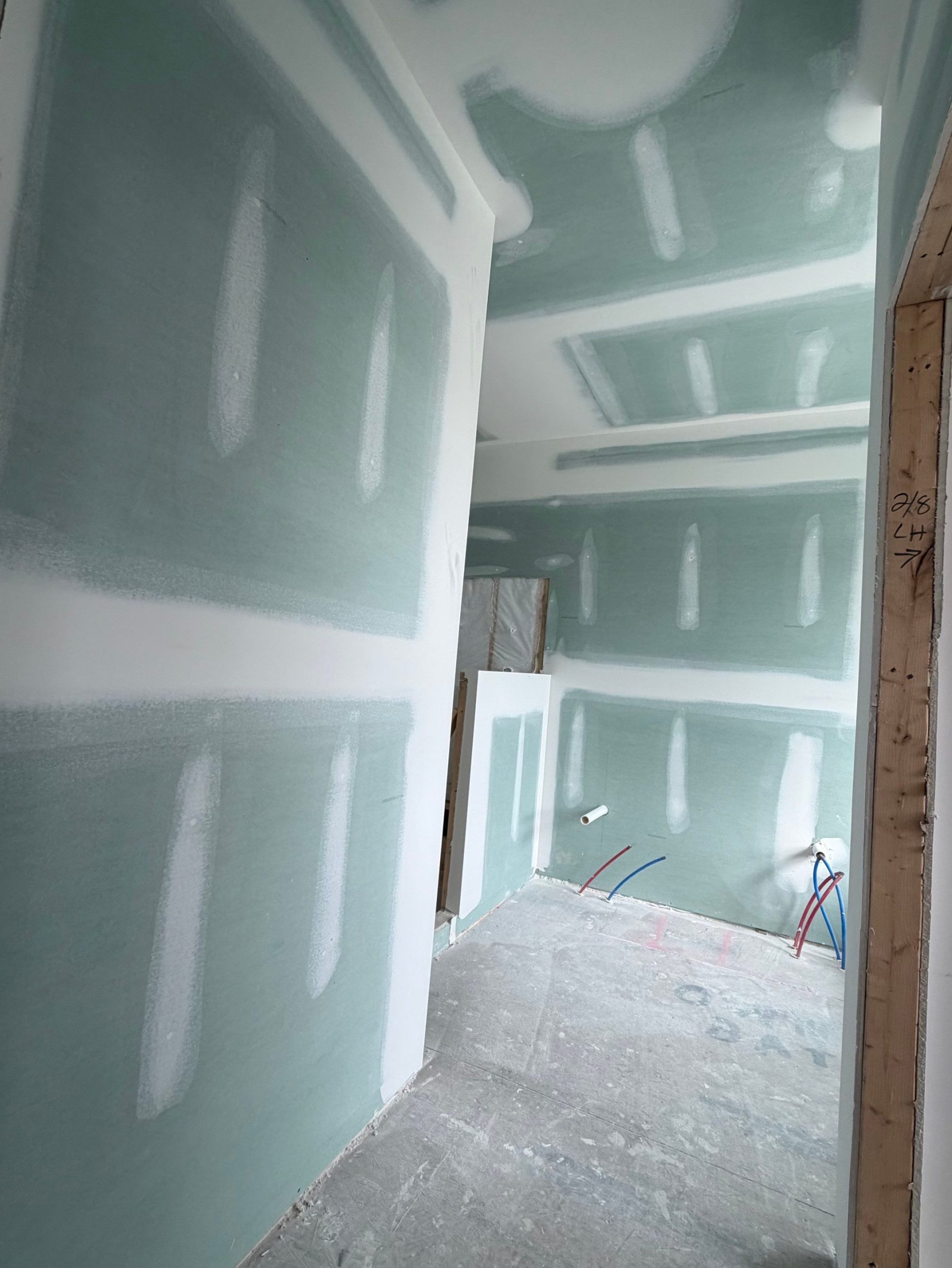 Taping knife finishing a drywall joint